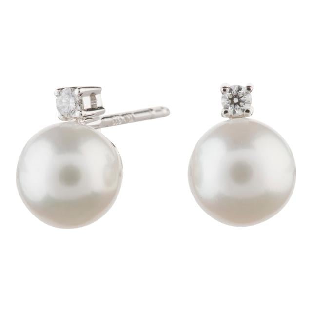 14kt. hvidgulds ørestik m. fvkp og 0,053 ct TW/SI - Urma.dk