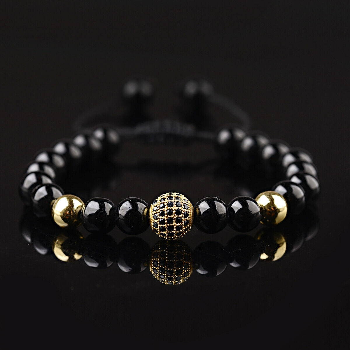 Flettet armbånd med onyx og zirconia