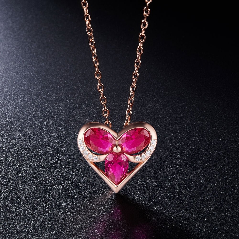 Halskæde i rosa forgyldt sølv med hjerte vedhæng med røde zirconia stene - Urma.dk