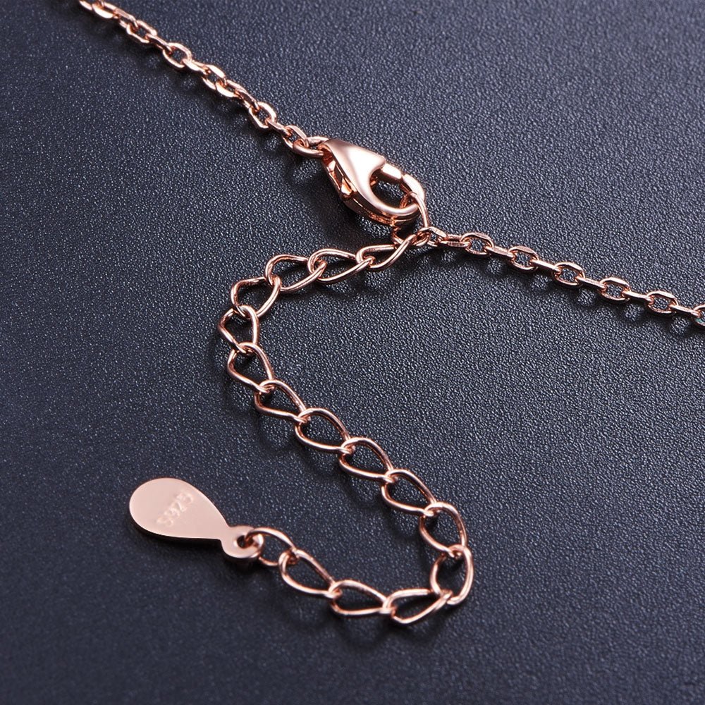 Halskæde i rosa forgyldt sølv med hjerte vedhæng med røde zirconia stene - Urma.dk