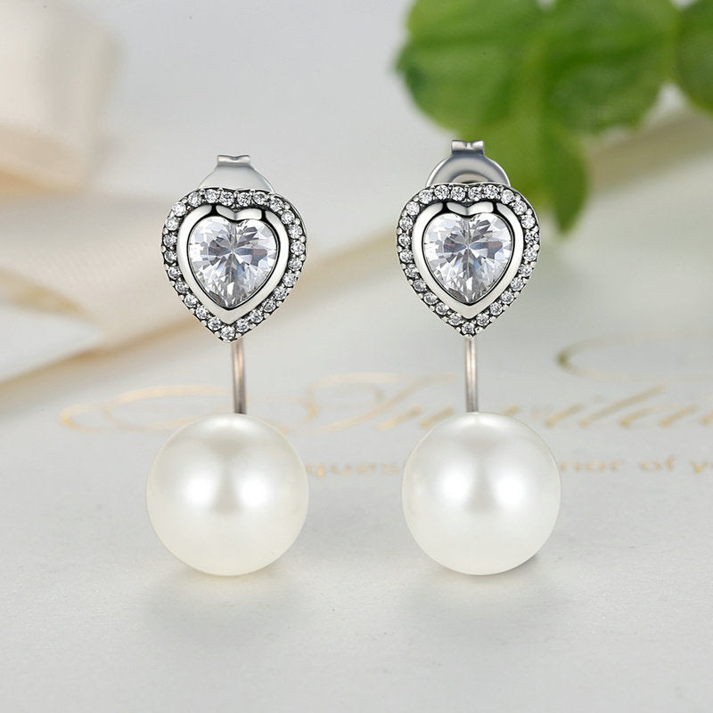 Dobbelte ørestikker i sølv med hjerte og perle