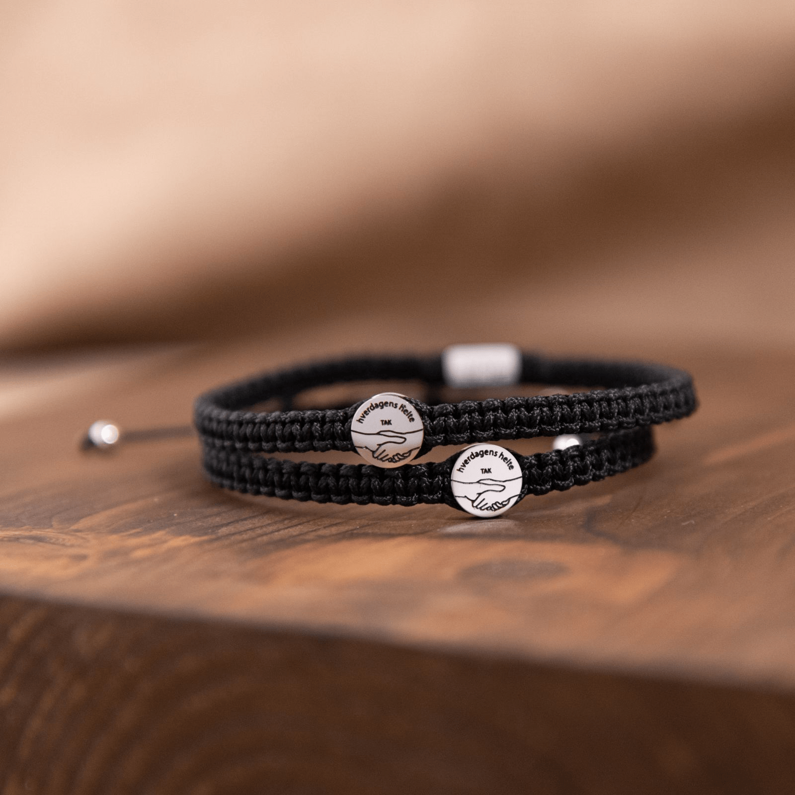 Takkearmbånd, herre, sort - Urma.dk